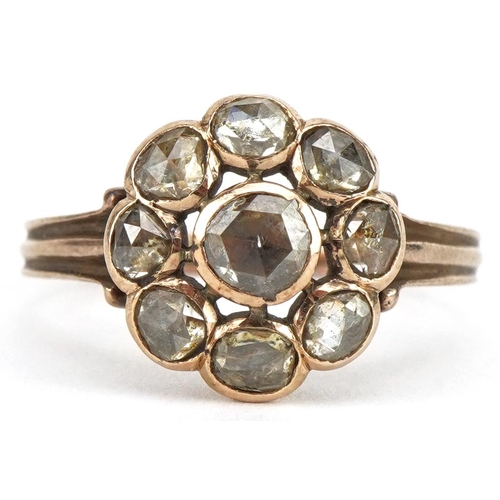 3025 - Antique unmarked gold diamond flower head ring, the central diamond approximately 4.20mm in diameter... 