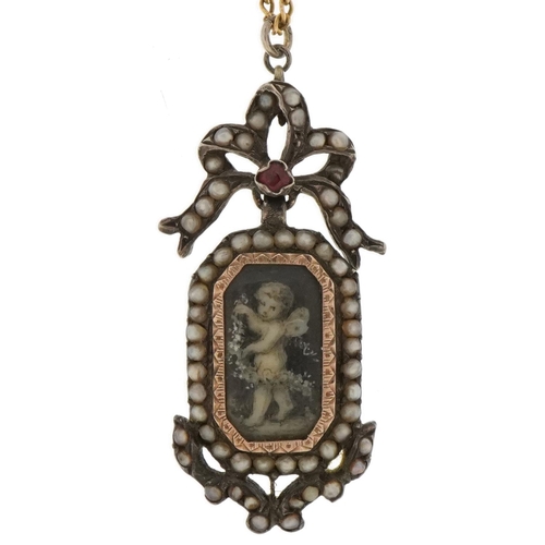 3043 - Antique unmarked silver and gold ruby and seed pearl pendant hand painted with Putti on a 15ct gold ... 