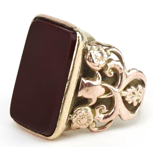 3069 - Antique 9ct gold carnelian signet ring with ornate floral pierced shoulders, size P/Q, 12.8g