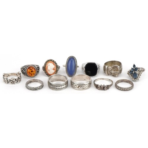 3660 - Twelve silver rings, some set with semi precious stones, including black onyx signet ring and cameo,... 