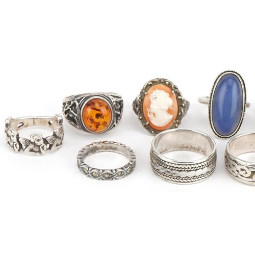 3660 - Twelve silver rings, some set with semi precious stones, including black onyx signet ring and cameo,... 