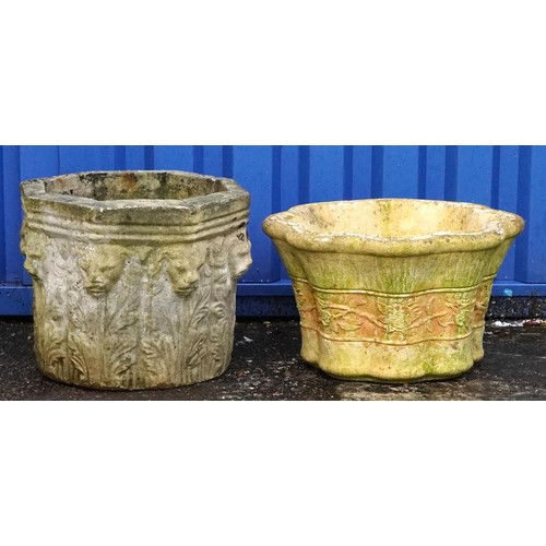 2224 - Two garden stoneware garden planters, one decorated with lion heads, the largest 34cm high