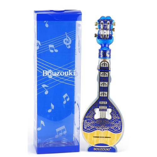 2390 - Bottle of Greek Bouzouki housed in an instrument design decanter bottle with box