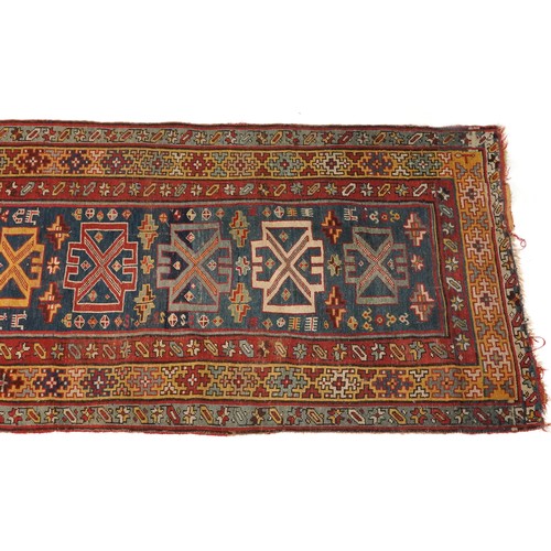 2195 - Rectangular Persian rug with blue ground central field having an allover repeat design, 270cm x 100c... 