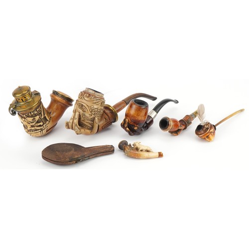 1252 - Six antique Meerschaum smoking pipes including three carved with hands, one carved with a wild anima... 