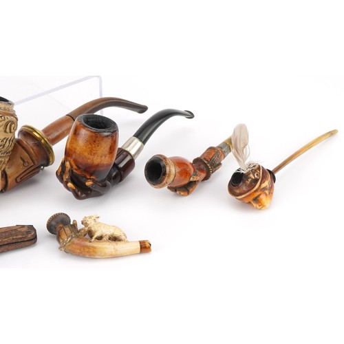 1252 - Six antique Meerschaum smoking pipes including three carved with hands, one carved with a wild anima... 