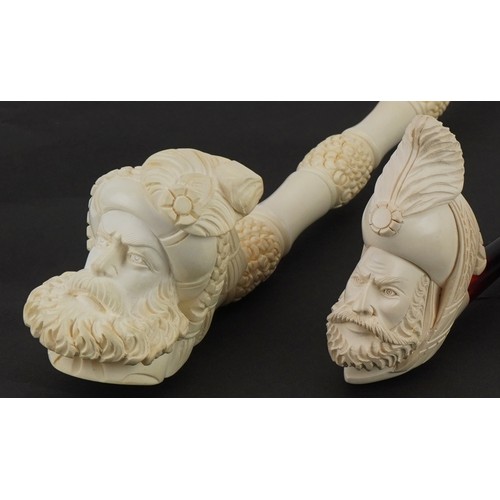 1254 - Four block Meerschaum tobacco smoking pipes, three with fitted cases, each with cherry amber coloure... 