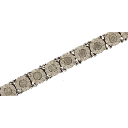 3045 - 9ct white gold diamond line bracelet, total diamond weight approximately 1.0 carat, 18cm in length, ... 