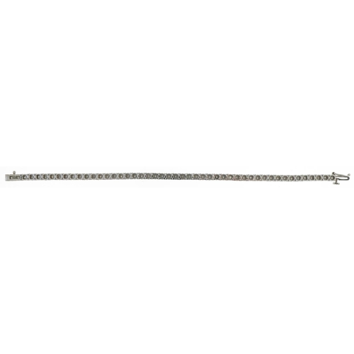 3045 - 9ct white gold diamond line bracelet, total diamond weight approximately 1.0 carat, 18cm in length, ... 