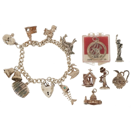 3538 - Silver charm bracelet with a selection of mostly silver charms including hatching egg with chick, st... 