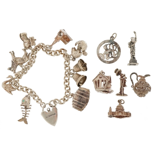 3538 - Silver charm bracelet with a selection of mostly silver charms including hatching egg with chick, st... 