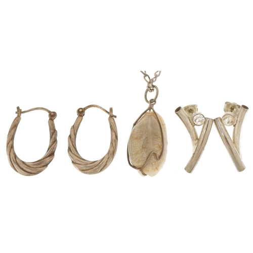 3711 - Silver and white metal jewellery comprising two pairs of earrings and a shell pendant on a curb link... 