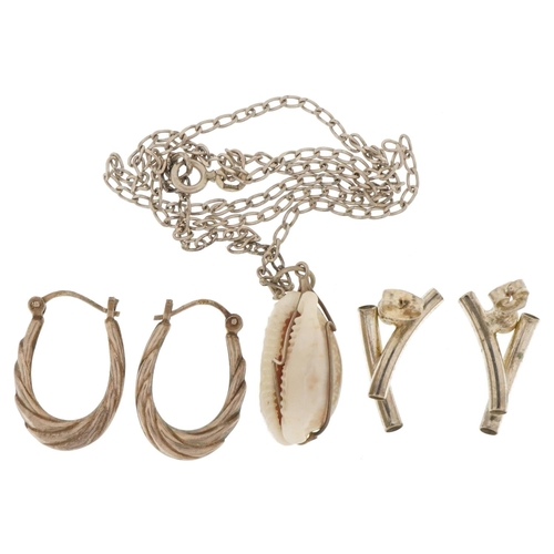 3711 - Silver and white metal jewellery comprising two pairs of earrings and a shell pendant on a curb link... 