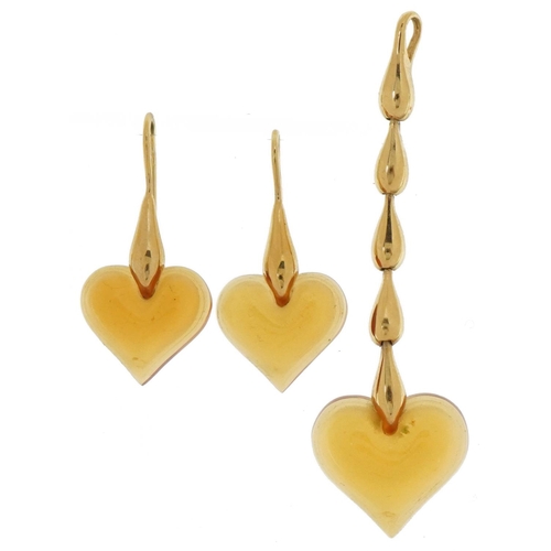 3167 - Lalique, French amber crystal love heart pendant and earrings with gold plated mounts with box, the ... 