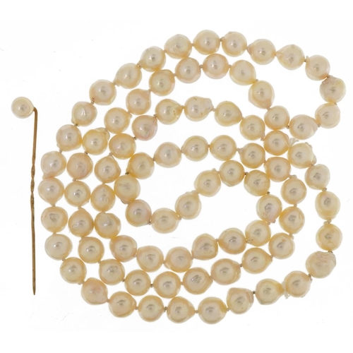 3543 - Single row Baroque pearl necklace and a cultured pearl stickpin housed in an Octee & Son case, the n... 