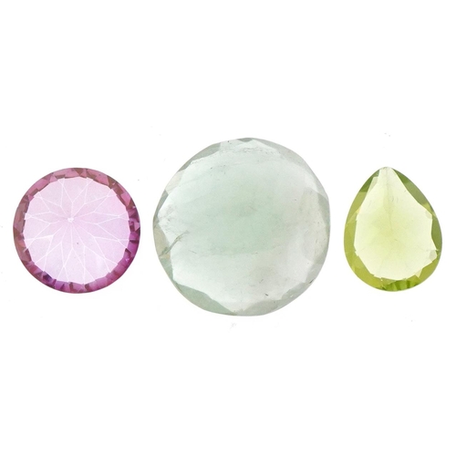 3513 - Three natural gemstones with certificates comprising topaz, pink topaz and peridot