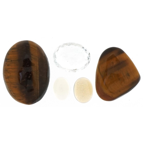 3746 - Five natural gemstones with certificates comprising white fire opal, tiger's eye and aquamarine