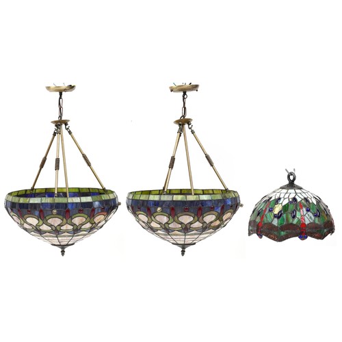 2437 - Three Art Nouveau style Tiffany design leaded light pendants including a pair, the pair each 44cm in... 