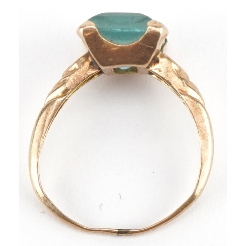 2641 - 9ct gold blue stone ring with engraved shoulders, size H, 1.6g