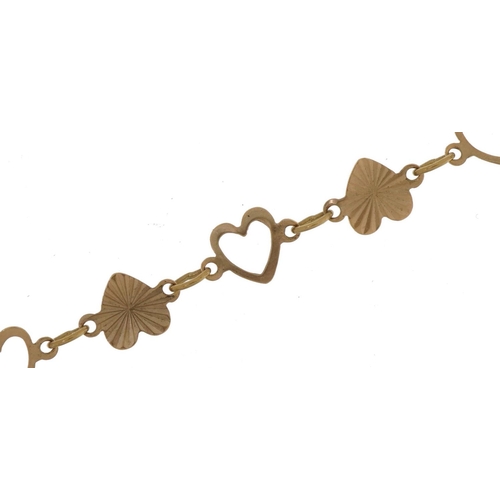 2754 - 9ct gold engine turned and pierced love heart bracelet, 18cm in length, 2.5g