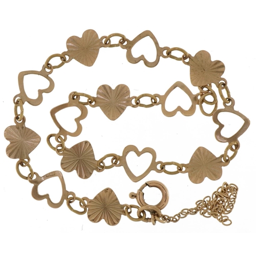 2754 - 9ct gold engine turned and pierced love heart bracelet, 18cm in length, 2.5g