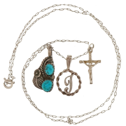 2737 - Three silver and white metal pendants, one with turquoise, on a silver necklace, 3.8g