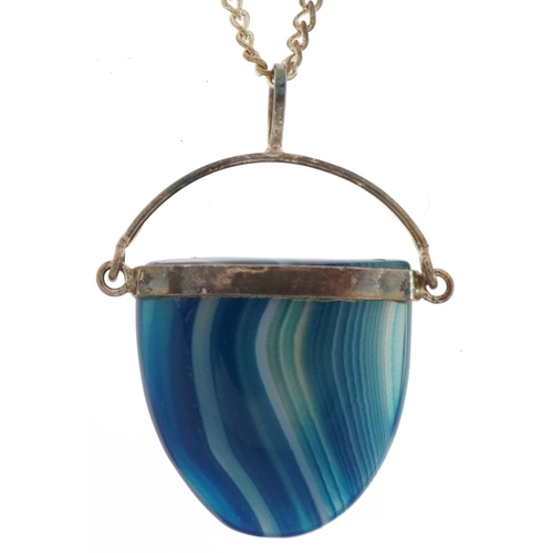 2809 - Silver mounted blue agate pendant on a white metal watch chain, 3.8cm high and 50cm in length, total... 