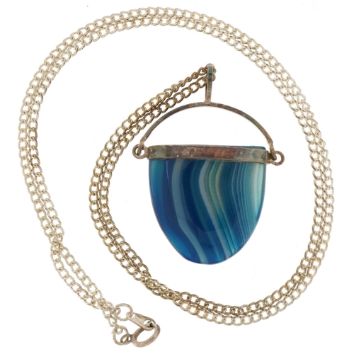 2809 - Silver mounted blue agate pendant on a white metal watch chain, 3.8cm high and 50cm in length, total... 