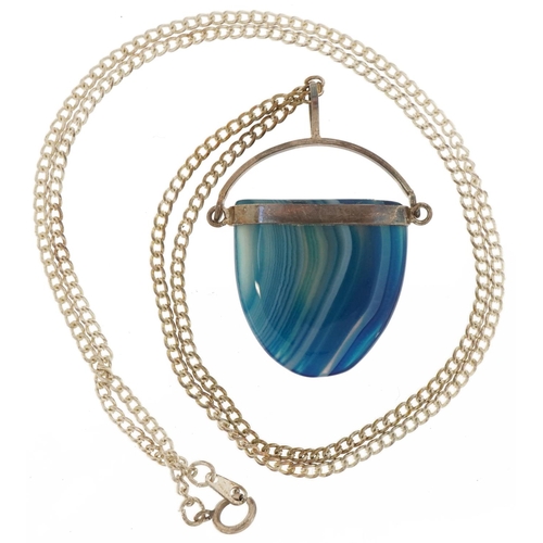 2809 - Silver mounted blue agate pendant on a white metal watch chain, 3.8cm high and 50cm in length, total... 