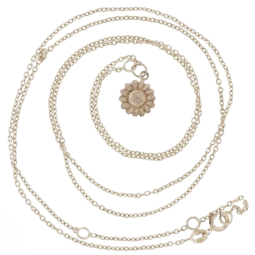 2802 - Unmarked silver flower head pendant on a silver chain link necklace, 1.3cm high and 80cm in length, ... 