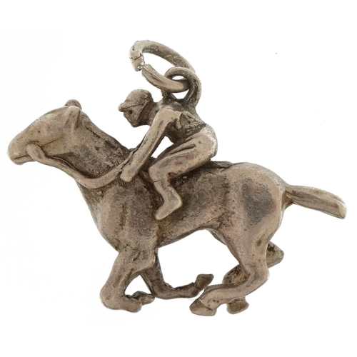 2758 - Silver jockey on horseback charm, 2.6cm wide, 6.1g