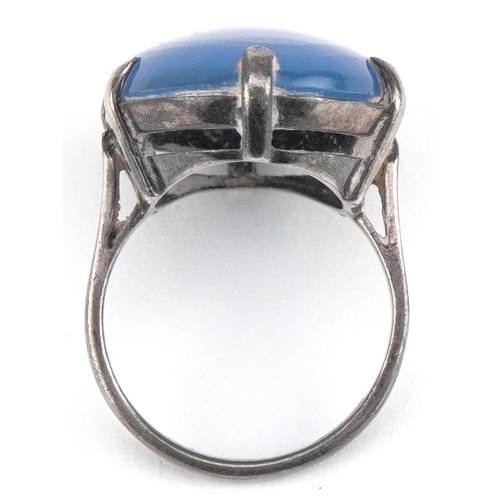 2629 - Silver cabochon blue stone ring, the stone approximately 25mm x 17mm, size N/O, 7.5g