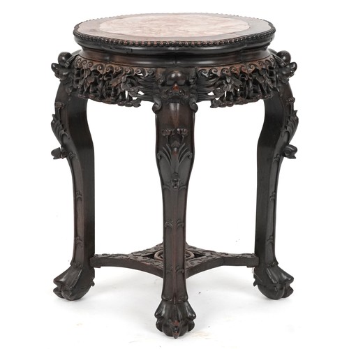 2060 - Chinese hardwood stand with inset marble top, carved and pierced with mythical heads and gourds on c... 