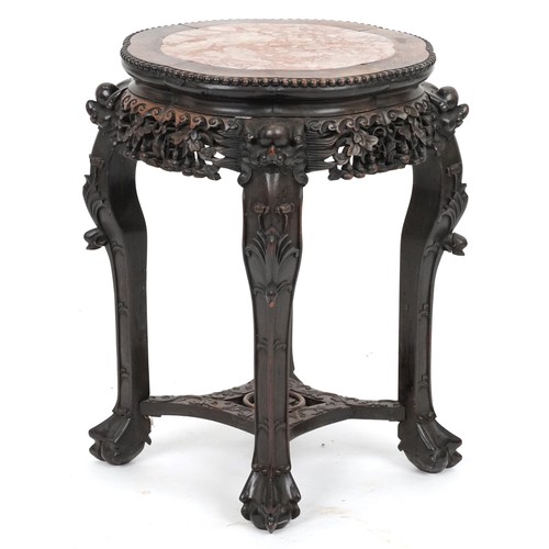 2060 - Chinese hardwood stand with inset marble top, carved and pierced with mythical heads and gourds on c... 