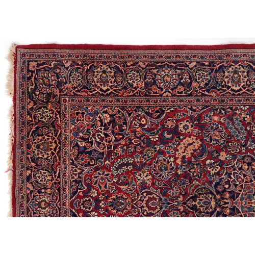 2182 - Rectangular Persian Sarouk type part silk red ground rug having an allover floral design, 214cm x 13... 