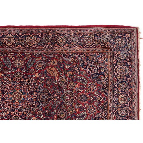 2182 - Rectangular Persian Sarouk type part silk red ground rug having an allover floral design, 214cm x 13... 