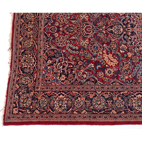 2182 - Rectangular Persian Sarouk type part silk red ground rug having an allover floral design, 214cm x 13... 