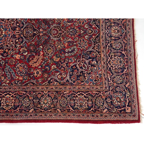 2182 - Rectangular Persian Sarouk type part silk red ground rug having an allover floral design, 214cm x 13... 