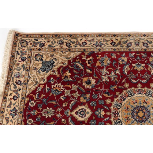 2184 - Rectangular Indian Rani rug having an allover repeat floral design on the red and cream grounds, 254... 