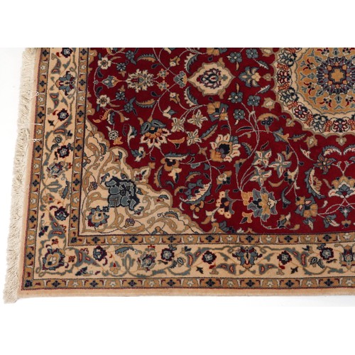 2184 - Rectangular Indian Rani rug having an allover repeat floral design on the red and cream grounds, 254... 