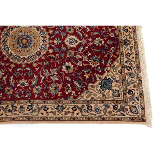 2184 - Rectangular Indian Rani rug having an allover repeat floral design on the red and cream grounds, 254... 