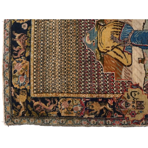 2181 - Rectangular Persian rug decorated with a figure praying, 129cm x 79cm