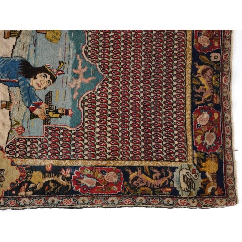 2181 - Rectangular Persian rug decorated with a figure praying, 129cm x 79cm