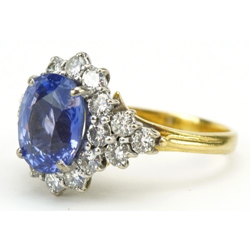 3035A - 18ct gold Sri Lankan sapphire and diamond four tier cluster ring, weight of the sapphire 6.54g, the ... 