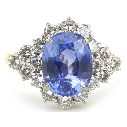 3035A - 18ct gold Sri Lankan sapphire and diamond four tier cluster ring, weight of the sapphire 6.54g, the ... 