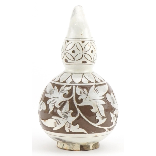 1288 - Chinese porcelain gourd vase having a white glaze incised with flowers, 16.5cm high