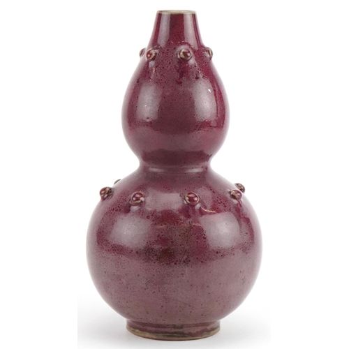 1270 - Chinese porcelain double gourd vase having a red glaze, 25cm high