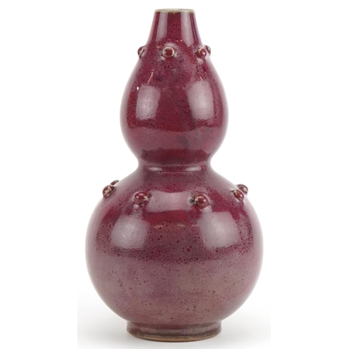 1270 - Chinese porcelain double gourd vase having a red glaze, 25cm high