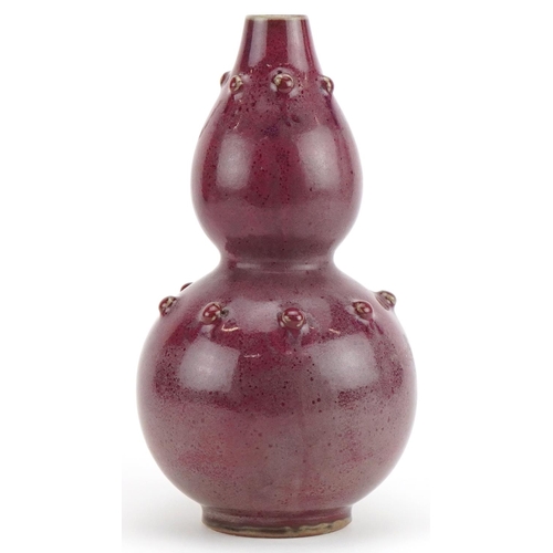 1270 - Chinese porcelain double gourd vase having a red glaze, 25cm high