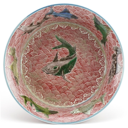 156 - Chinese porcelain bowl hand painted in the famille verte palette with fish amongst crashing waves, s... 